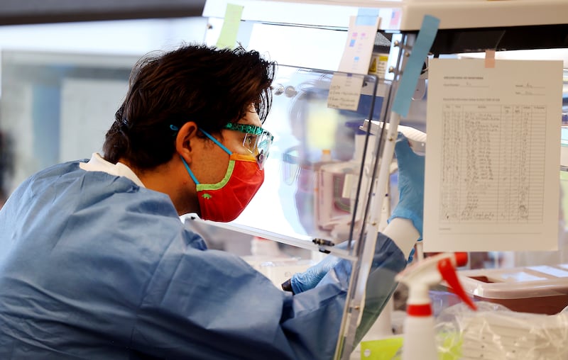Microbiologist Samuel Philips sequences COVID-19 samples for variants at the Utah Public Health Laboratory.