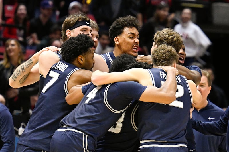 Utah State players celebrate after defeating San Diego State Saturday, Dec. 28, 2024, in San Diego.
