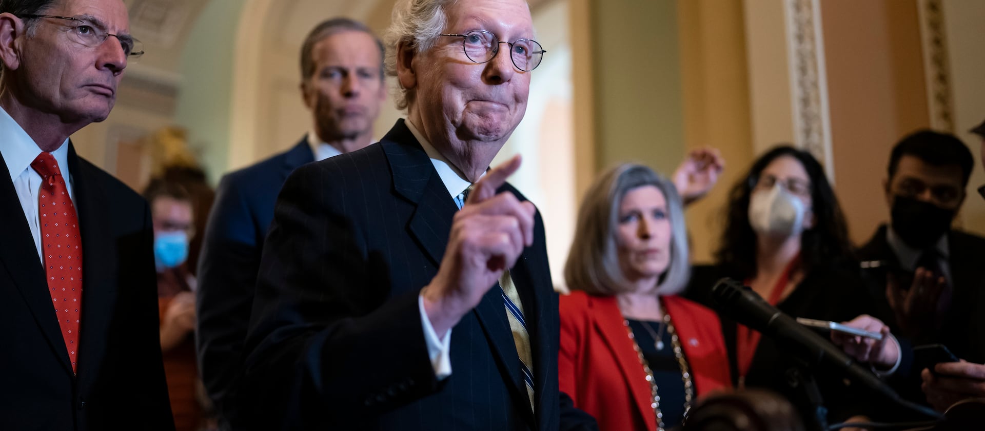 Senate Minority Leader Mitch McConnell, R-Ky., joined from left by Sen. John Barrasso, R-Wyo., Minority Whip John Thune, R-S.D., and Sen. Joni Ernst, R-Iowa, talks to reporters.