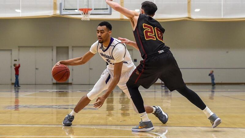 Dayon Goodman (left-center) puts the moves on his defender.