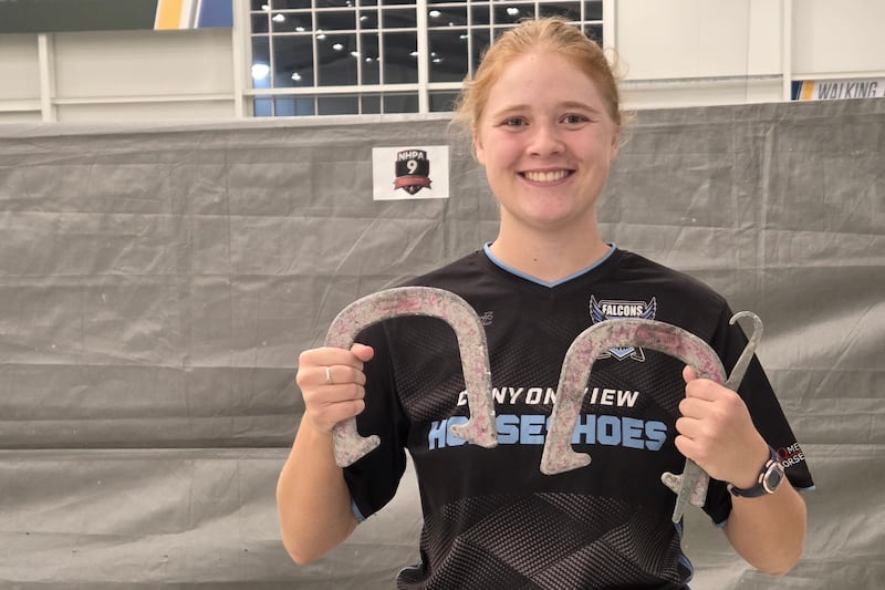 Adilaide Ohms, 18, holds up her horseshoes after winning the 2026 National Horseshoe Pitchers Association World Horseshoe Tournament on July 18, 2026.