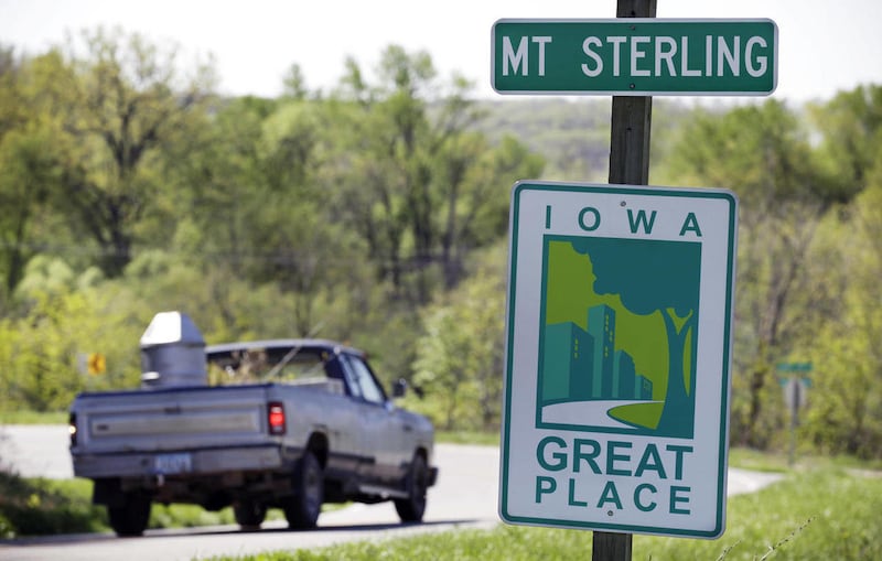 A pickup truck enters the city limits of Mount Sterling, Iowa, Friday, April 6, 2012. The small southeast Iowa town with a population of about 40 plans to disband next week because no resident wants to serve as mayor or on the City Council. It will be