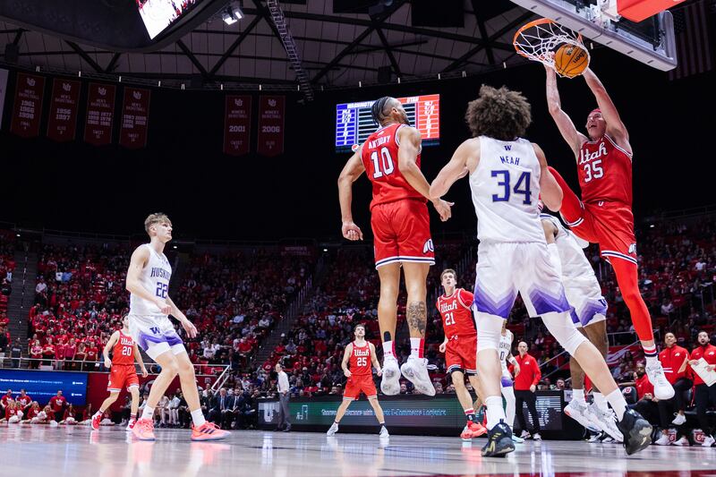 Utah’s Branden Carlson dunks during a game against Washington at the Huntsman Center in Salt Lake City on Jan. 21, 2023.