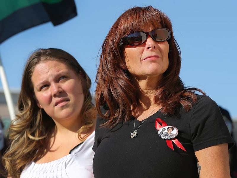 In this Thursday, Sept. 10, 2015 file photo, Melissa Romero stands with Susan Hunt watching balloons rise into the sky as family and friends of Darien Hunt gather in Saratoga Springs on the one year anniversary of Hunt's death after being shot and killed