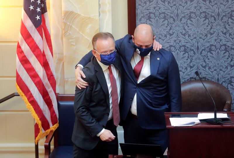 Utah Senate President Stuart Adams, R-Layton, left, hugs Dan Hemmert, director of the Governor’s Office of Economic Development.