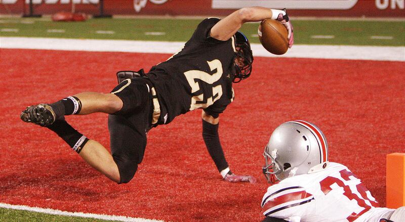 Desert Hills' Jordan Hokanson scores one of his two touchdowns in front of Spanish Fork's Trevor Perkins, but the Thunder came up short in Thursday's 3A semifinal, 35-28.