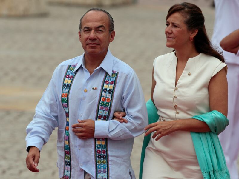 FILE - In this April 14, 2012 file photo, Mexico's President Felipe Calderon and his wife, first lady Margarita Zavala arrive for the opening ceremony of the sixth Summit of the Americas in Cartagena, Colombia. Zavala announced Friday, Oct. 6, 2017, she i