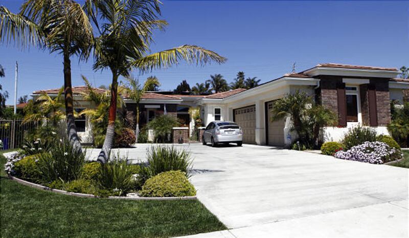 The home of former "Survivor" producer Bruce Beresford-Redman and his wife Monica is seen in the Los Angeles suburb of Rancho Palos Verdes, Calif., Thursday.