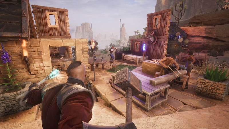A player-controlled warrior oversees construction in the Exiled Lands in "Conan Exiles."