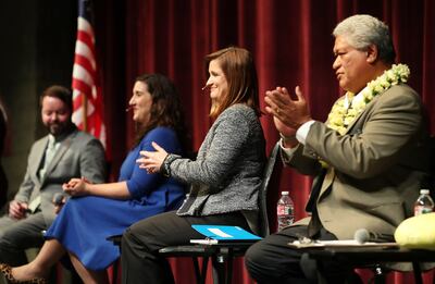 Arlyn Bradshaw, Shireen Ghorbani, Jenny Wilson and Stone Fonua applaud as the Salt Lake County Democratic party holds a debate for the Salt Lake County mayoral candidates in Sandy on Thursday, Jan. 24, 2019.