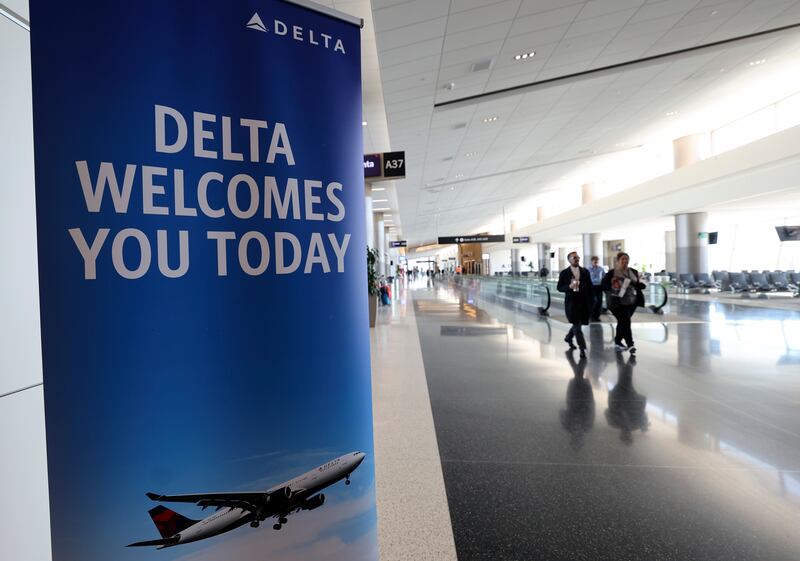 People move through Salt Lake City International Airport in Salt Lake City on Tuesday, Oct. 31, 2023.