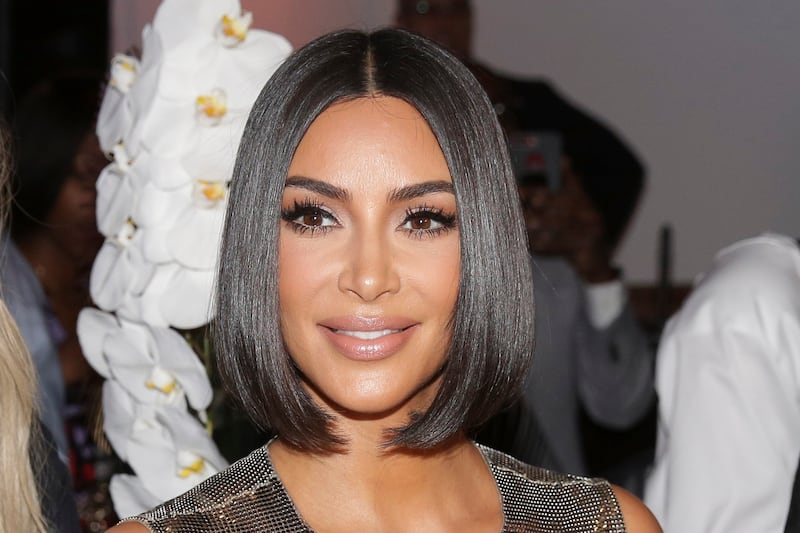FILE - This Sept. 10, 2019, file photo shows Kim Kardashian arriving to the Serena Williams fashion show during Fashion Week in New York. Kim Kardashian West is selling a stake in her beauty brand for $200 million, in a deal that values the TV reality star’s three-year-old business at $1 billion. The buyer is Covergirl owner Coty Inc., which will get a 20% stake in KKW Beauty.