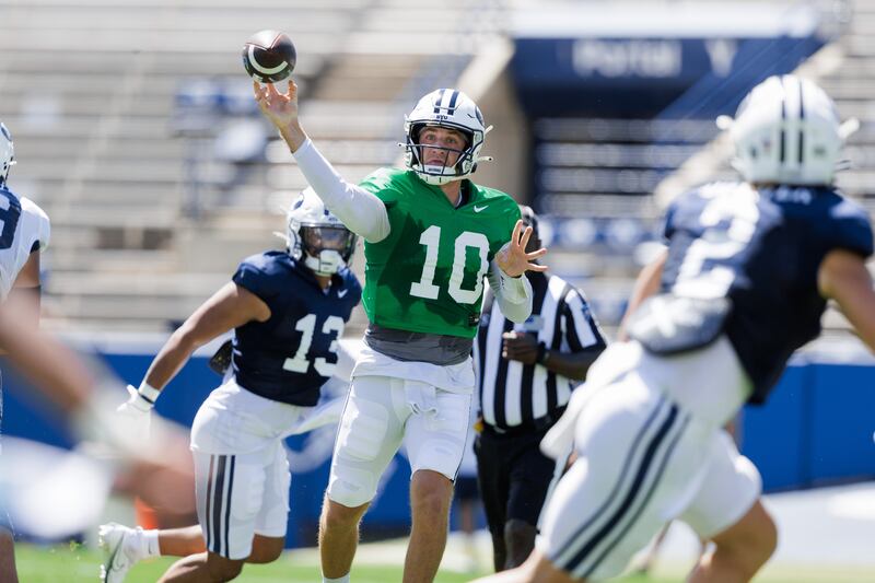 BYU quarterback Kedon Slovis throws a pass during a team scrimmage at LaVell Edwards Stadium in Provo, Aug. 12, 2023.