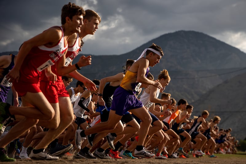 Runners start off in the varsity boys race of the 2021 BYU Autumn Classic at Timpanogos Golf Club in Provo.