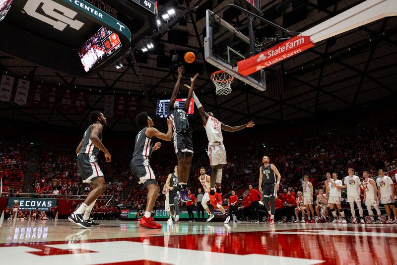 Washington State Cougars center Rueben Chinyelu (20) and Utah Utes center Keba Keita (13) jump up for a rebound during a men’s college basketball game between the University of Utah and Washington State University at the Jon M. Huntsman Center in Salt Lake City on Friday, Dec. 29, 2023.
