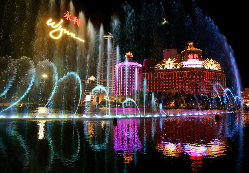 The fountain of the Wynn Macau casino performs celebrating it's opening with the backgroung of the Lisboa Casino in Macau, Tuesday, Sept. 5, 2006. American gaming mogul Stephen Wynn was ready to throw open the doors of his new US$1.2 billion casino to gam