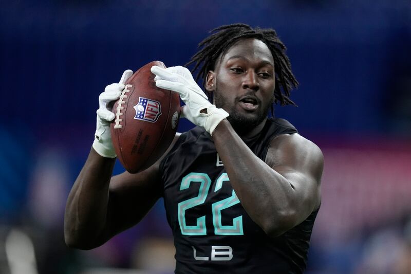 Utah linebacker Devin Lloyd runs a drill at the NFL scouting combine, Saturday, March 5, 2022, in Indianapolis.