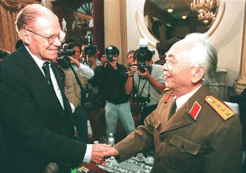 Former Defense Secretary Robert S. McNamara shakes hands with Vietnamese General Vo Nguyen Giap.
