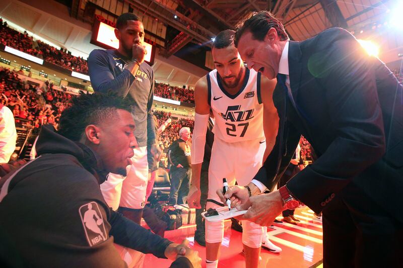 Utah Jazz guard Donovan Mitchell (45), Utah Jazz forward Royce O'Neale (23), Utah Jazz center Rudy Gobert (27) and Utah Jazz head coach Quin Snyder talk before the Jazz play the Houston Rockets in Game 5 of the NBA playoffs at the Toyota Center in Houston