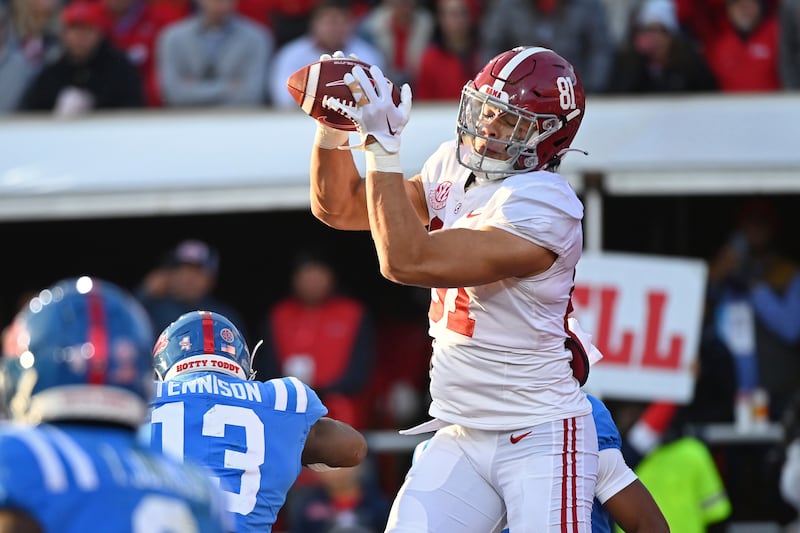 Alabama tight end Cameron Latu catches a touchdown pass over Mississippi’s Ladarius Tennison during a game on Nov. 12, 2022.