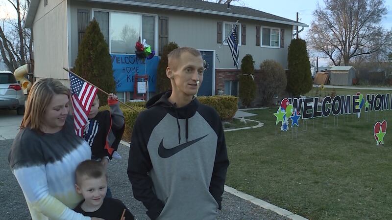 Kelton Bronson stands with his family after returning home to Corinne, Box Elder County, on Wednesday, March 27, 2019.