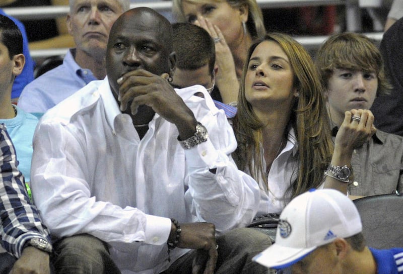 FILE - In this April 21, 2010, file photo, Michael Jordan and Yvette Prieto, right, watch the second half of Game 2 of a first round NBA basketball playoff game between the Orlando Magic and the Charlotte Bobcats in Orlando, Fla. Michael Jordan is engage