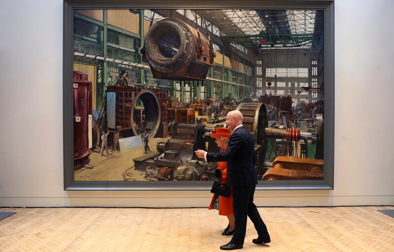 Britain's Queen Elizabeth II walks with London Science Museum Director Ian Blatchford during a visit to the museum for the announcement of their summer exhibition "Top Secret" in Kensington, London, Thursday March 7, 2019.