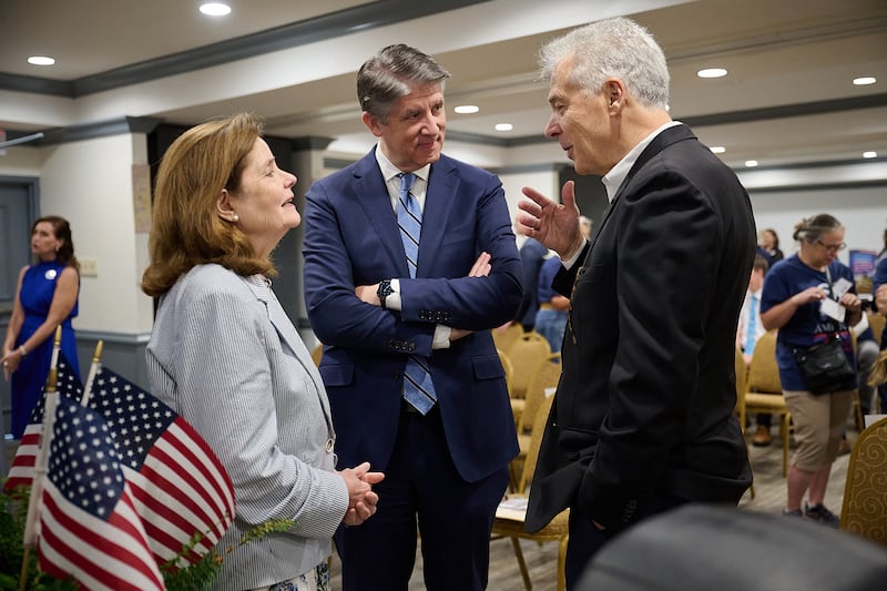 From left to right, commissioner Cathy Gillespie of America250, Elder Matthew S. Holland of the church's communication department and David Woodyard of Catholic Charities Dallas talk at Joe's Food Pantry in Dallas, Texas, on May 14, 2026.