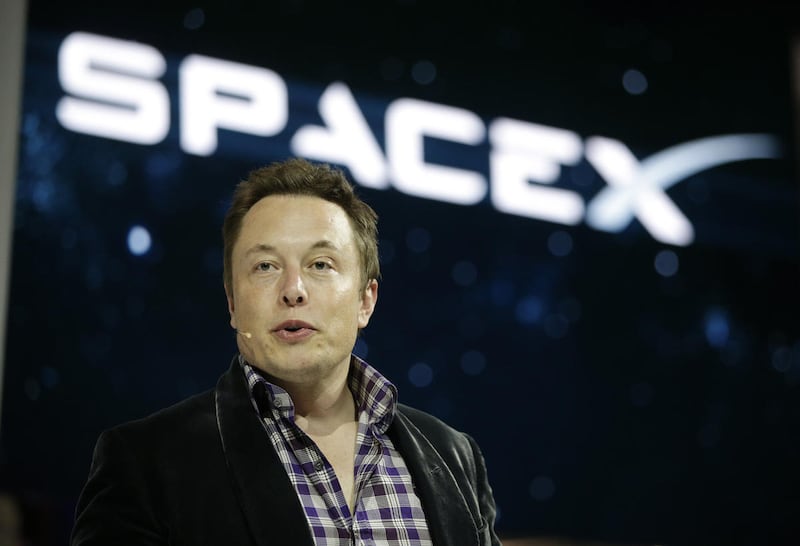 In this May 29, 2014 file photo, Elon Musk, CEO and CTO of SpaceX, introduces the SpaceX Dragon V2 spaceship at the SpaceX headquarters in Hawthorne, Calif.