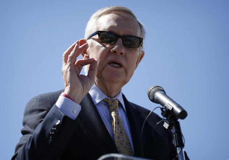 Senate Minority Leader Harry Reid, D-Nev., speaks at a groundbreaking ceremony for the Interstate 11 Boulder City bypass project Monday, April 6, 2015, in Boulder City, Nev. Davis County Attorney Troy Rawlings confirmed that he is investigating Reid based