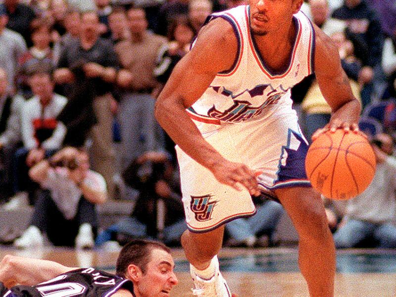Utah Jazz's Shandon Anderson drives past Sacramento Kings' Jon Barry in the second half of the game on February 15, 1999.
