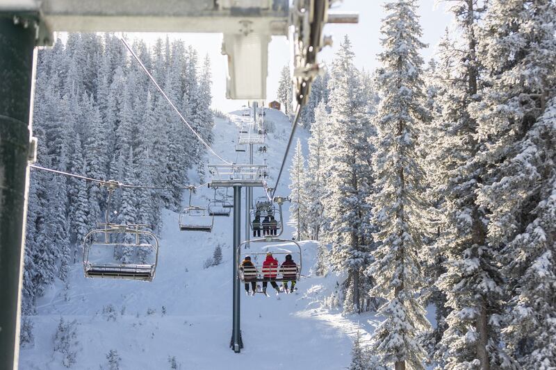 Skiers ride the lift at Brighton Resort in Big Cottonwood Canyon.