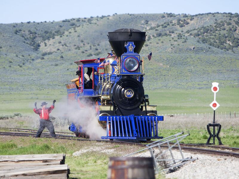Senior Engineer, Richard Carroll, directs Junior Engineer, Tom Brown, as he backs the Jupiter locomotive into position at the Golden Spike commemorative ceremony in Brigham City, Tuesday, May 10, 2016. The locomotives, which are exact replicas of the orig