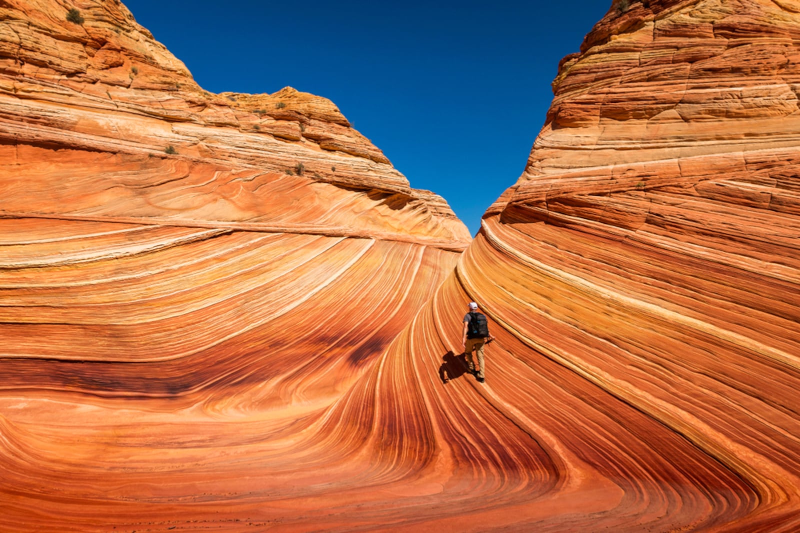 A person hikes the Wave in northern Arizona.