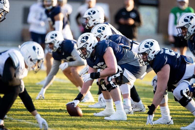 BYU players prepare for a play during spring camp in Provo on March 4, 2021. The Cougars open 2022 spring drill Feb. 28. 2022.