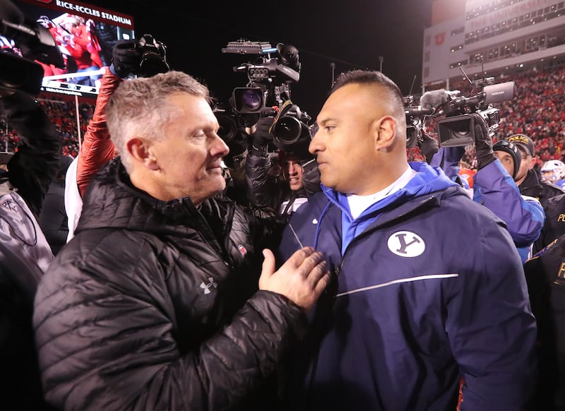 Utah coach Kyle Whittingham and BYU coach Kalani Sitake hug after game at Rice-Eccles Stadium in 2018. Utah won 35-27.