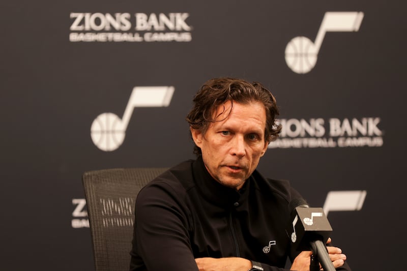 Utah Jazz head coach Quin Snyder, wearing black, speaks