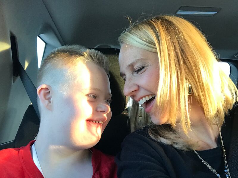 A tender moment with Emily Craynor and her son Mikey, who is 16. He has Down syndrome and is mostly nonverbal.