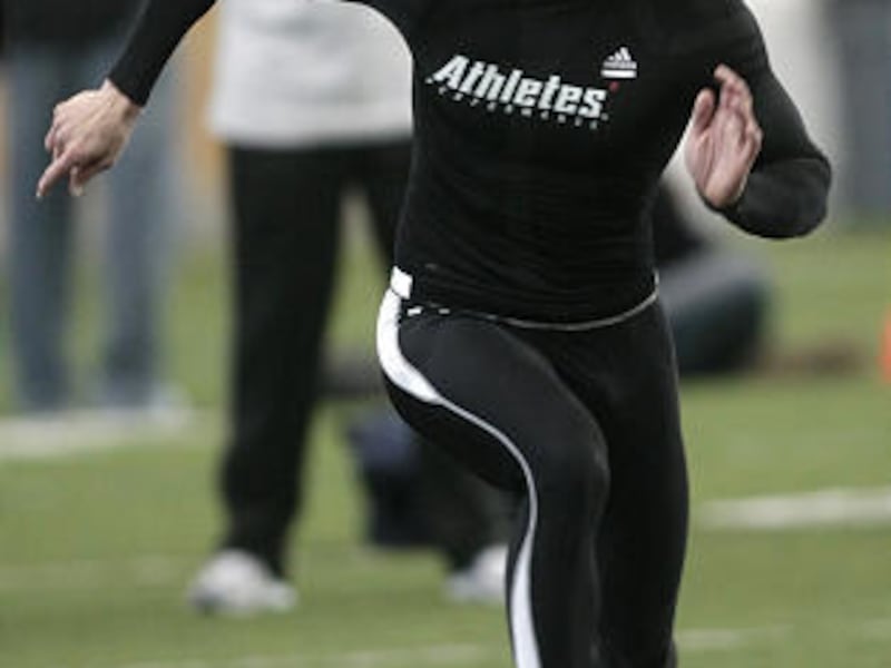 Former BYU receiver Austin Collie works out doing the shuttle run during the Cougars' Pro Day at the team practice field.