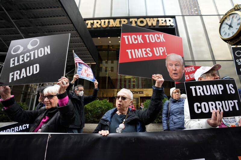 Protesters gather outside Trump Tower on March 31, 2023, in New York. Former President Donald Trump was indicted by a Manhattan grand jury on Thursday.