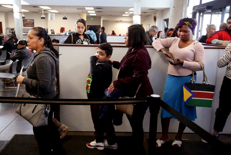People wait in line at the driver license division in West Valley City on Wednesday, Jan. 30, 2019.