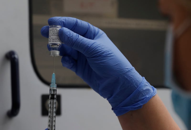 A vial of the Phase 3 Novavax coronavirus vaccine is seen ready for use in the trial at St. George’s University hospital in London Wednesday, Oct. 7, 2020.
