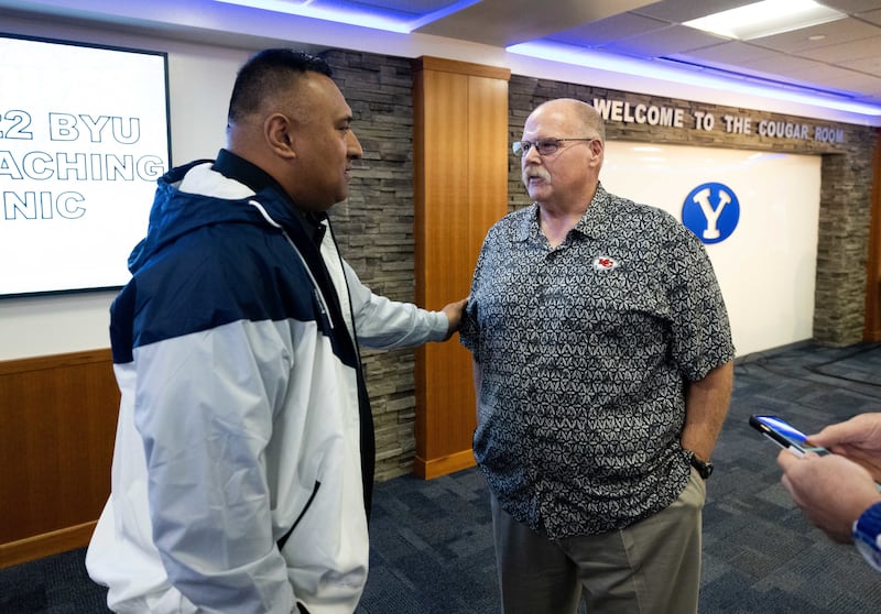 BYU football coach Kalani Sitake, left, talks with Kansas City Chiefs coach Andy Reid, a BYU alumni, during BYU’s Coaches Clinic on Thursday, March 24, 2022.