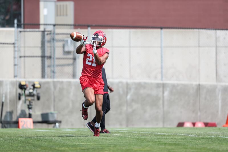 Utah receiver Solomon Enis catches a pass during fall camp at the University of Utah in Salt Lake City.