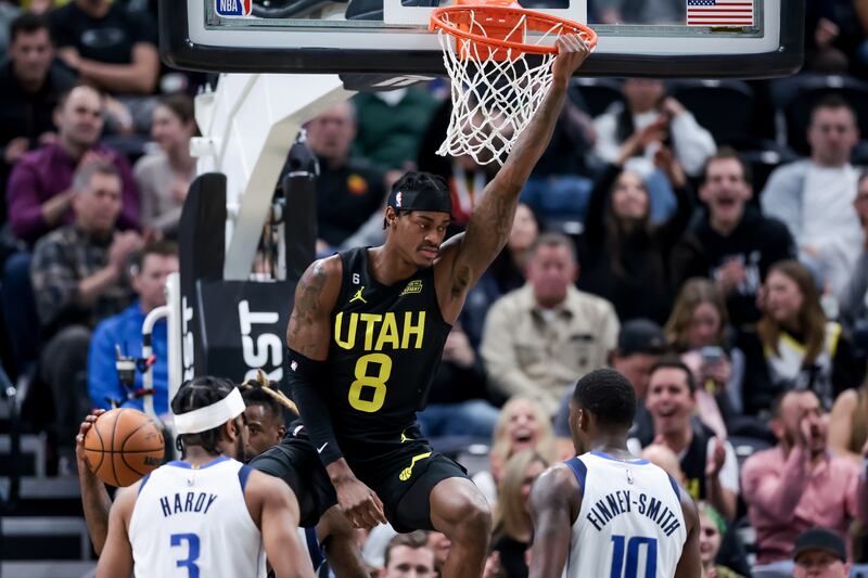 Utah Jazz forward Jarred Vanderbilt (wearing black) dunks during the game.