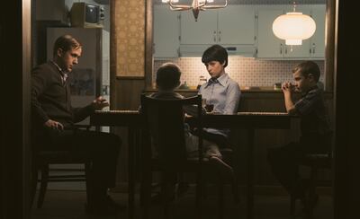 Ryan Gosling, left, plays Neil Armstrong, Connor Blodgett plays Mark Armstrong, Claire Foy plays Janet Armstrong and Luke Winters plays Rick Armstrong in “First Man.”