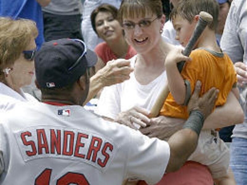 Rangers' Reggie Sanders gives bat to Nick O'Brien and his mom.