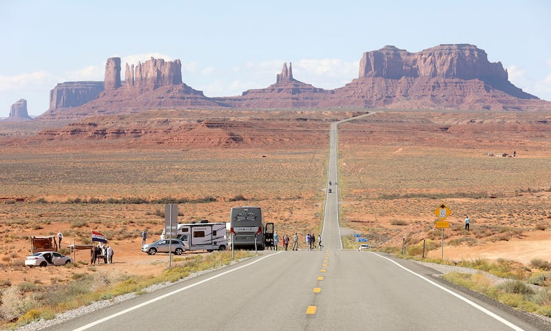 Tourists stop to take photos in Oljato-Monument Valley, San Juan County, on Friday, Oct. 1, 2021.