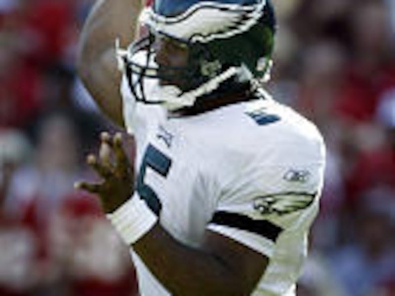 Philadelphia quarterback Donovan McNabb (5) throws down field during the second half of Sunday's win over K.C.
