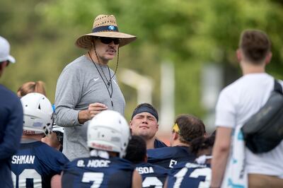 BYU offensive coordinator Jeff Grimes talks to the offense after the Cougars' first football practice at BYU in Provo on Thursday, Aug. 2, 2018.
